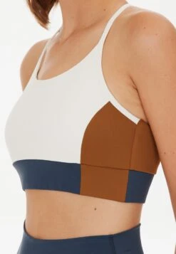 ATHLECIA Medium Support Bustier Sport Bh Sukey Dames Bruin / Wit -Sportieve Outfit Winkel 063cf3450cfa826907b37a094958f9af