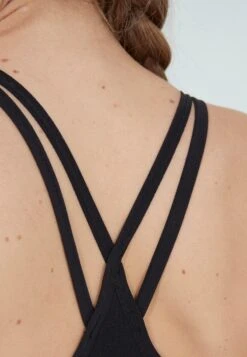 ATHLECIA Medium Support Bustier Sport Bh LINEA SEAMLESS Dames Zwart -Sportieve Outfit Winkel f81a3536c67720bdbe7770af9537a1af